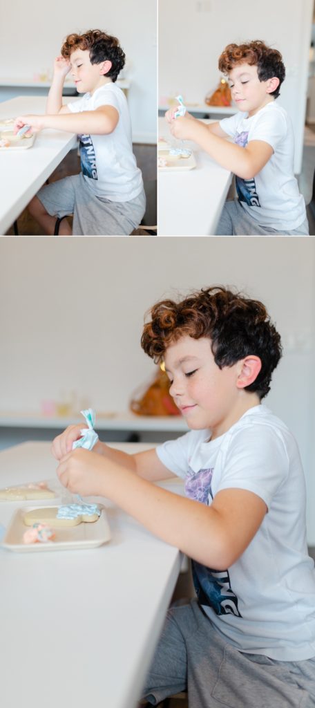 Young boy decorating sugar cookies at AWL Creative in Leesburg, Virginia