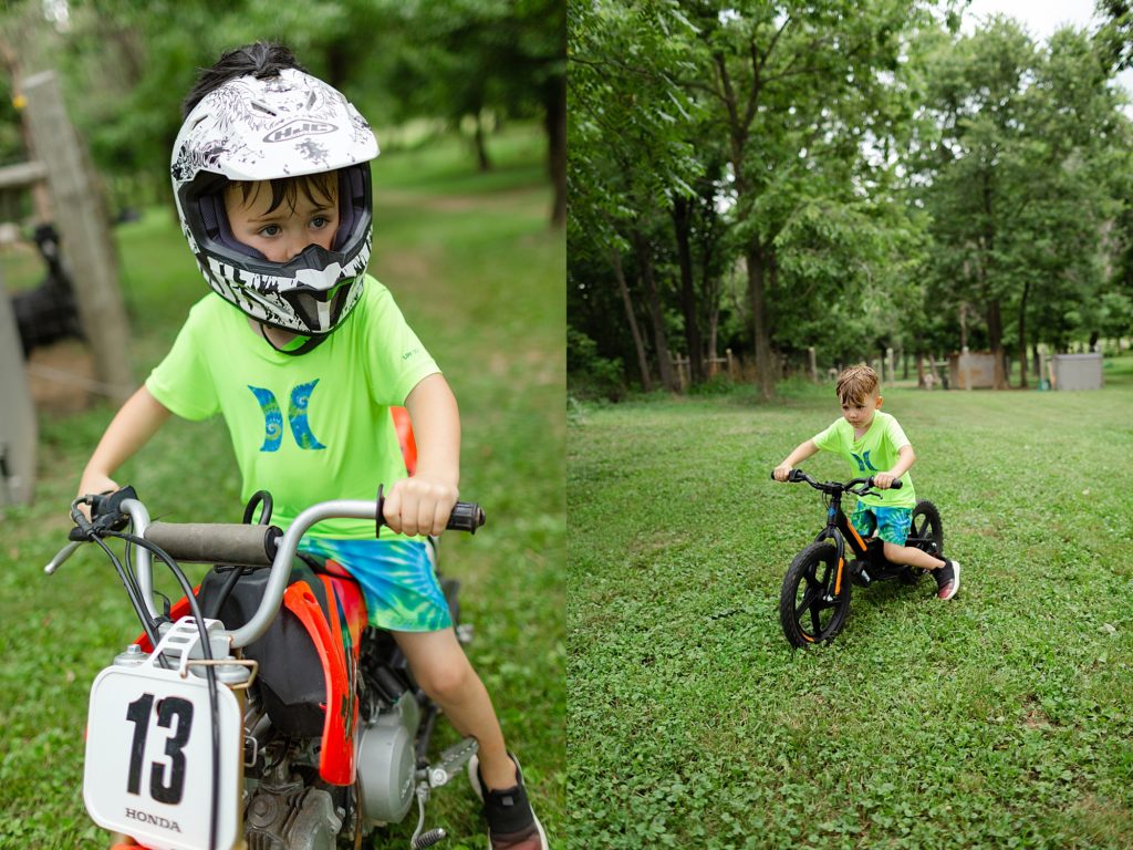 Four year old boy with a helmet on riding his Honda dirt bike.