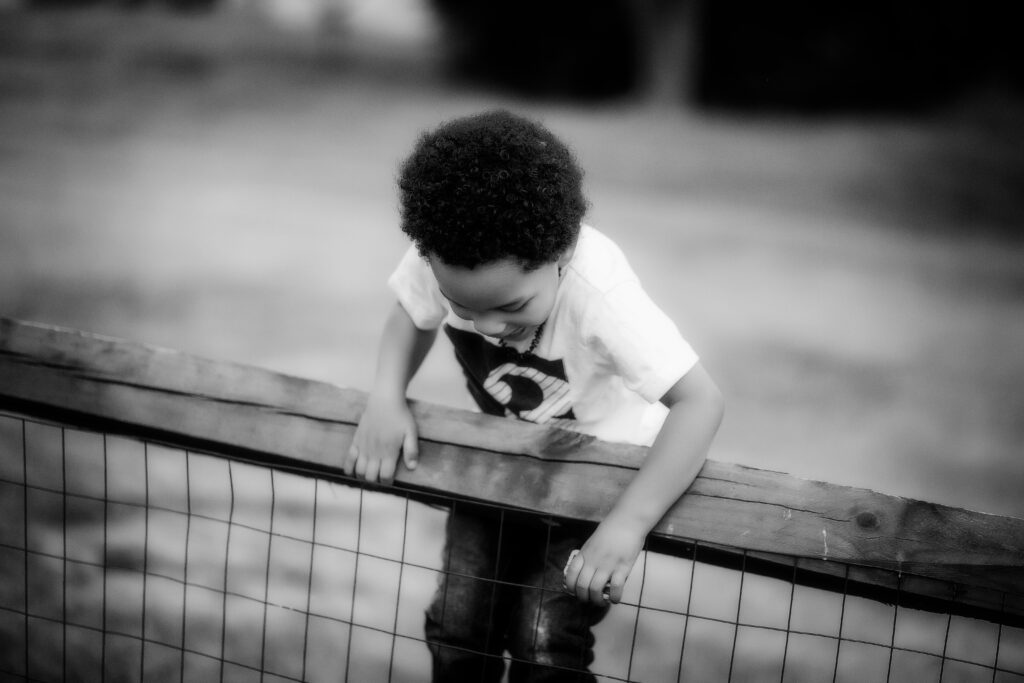 Part 2 | Three year old boy climbing a fence.  Summer Fun Starts Now  | Summer Bucket List.