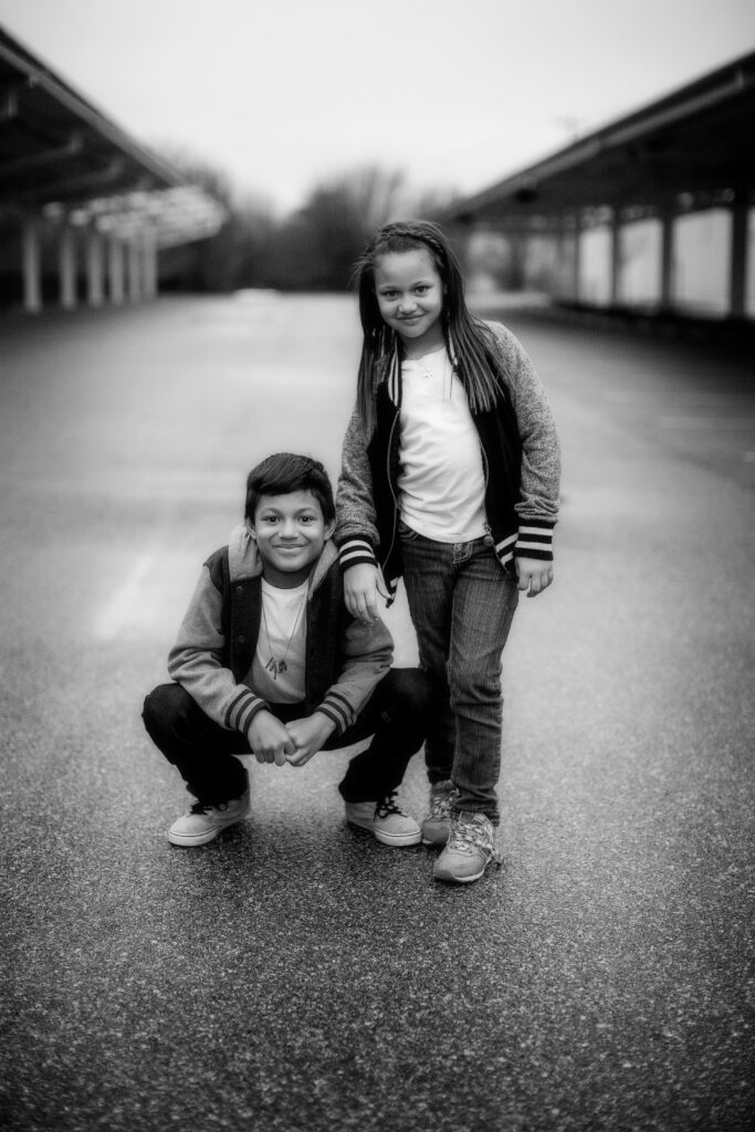 Northern Virginia | Siblings posed in the street in black and white.
