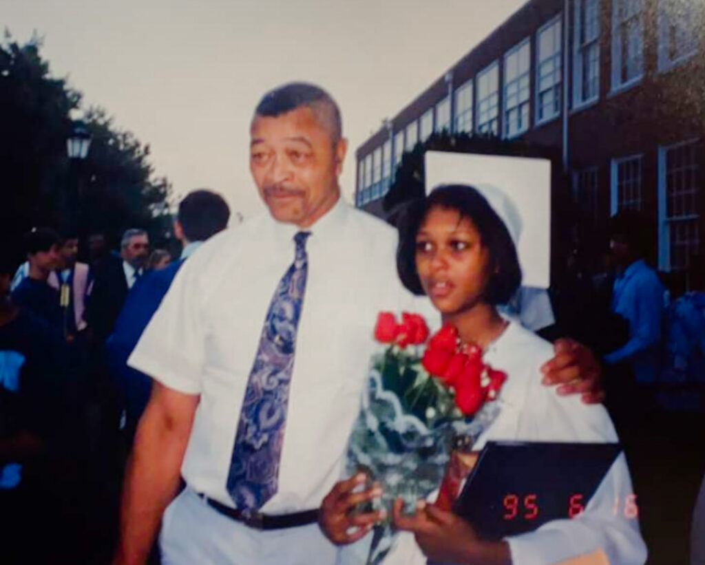 High School Graduation image of grandfather and granddaughter.