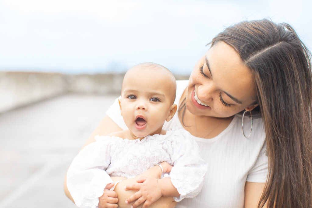 10 FAQs for a Photo session | Women holding baby with no hair and they both have on white