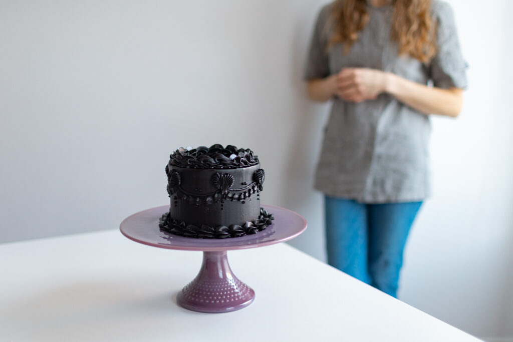 A cake on a purple plate.
